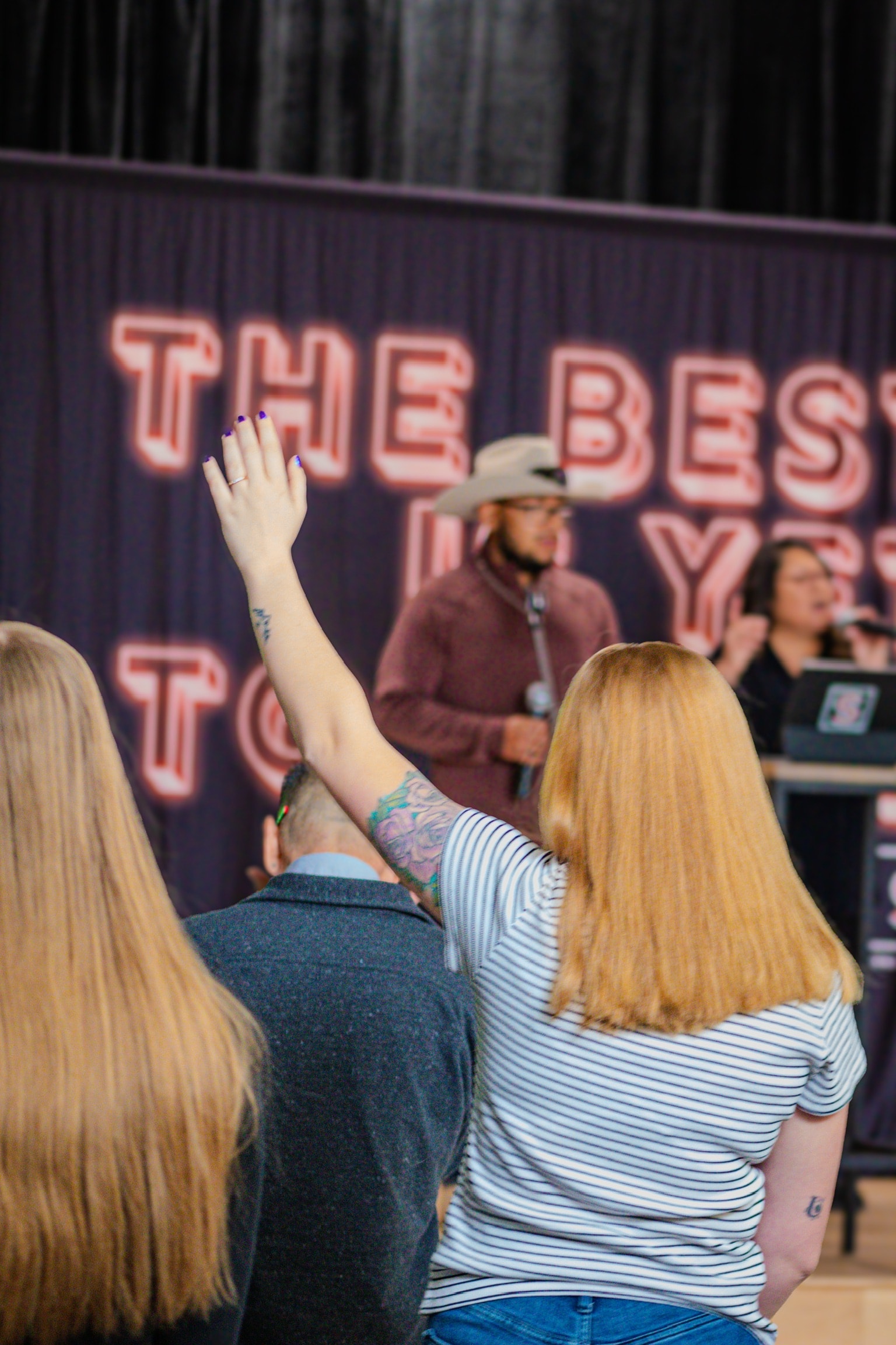 Congregation raising hands in worship
